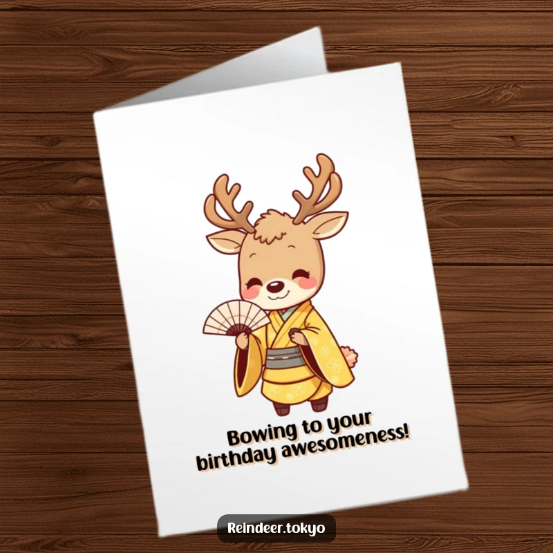 Funny free printable birthday card: a smiling reindeer in a golden kimono bows gracefully with a fan.
