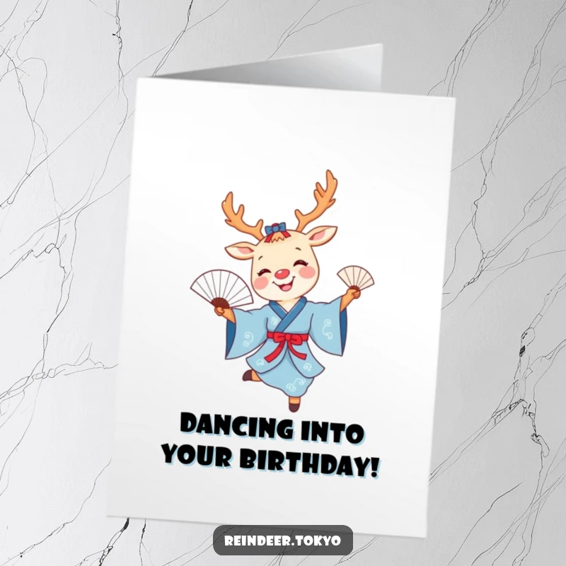 Funny Free Printable Birthday Card: Smiling reindeer in blue kimono joyfully dances with a fan.
