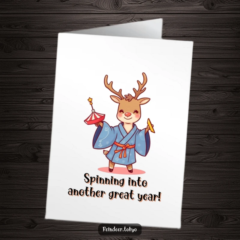 Funny free printable birthday card featuring a smiling reindeer in a blue kimono twirling a spinning top.