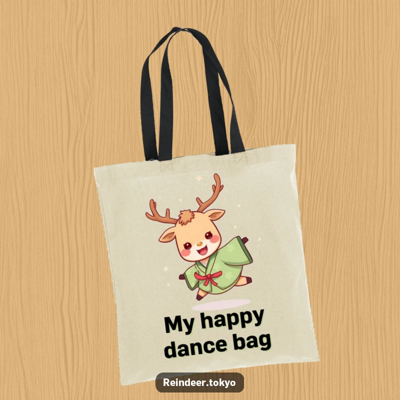 Funny tote bag showcasing a cheerful reindeer in a green kimono, energetically spinning with a delighted look, perfect for carrying items humorously.